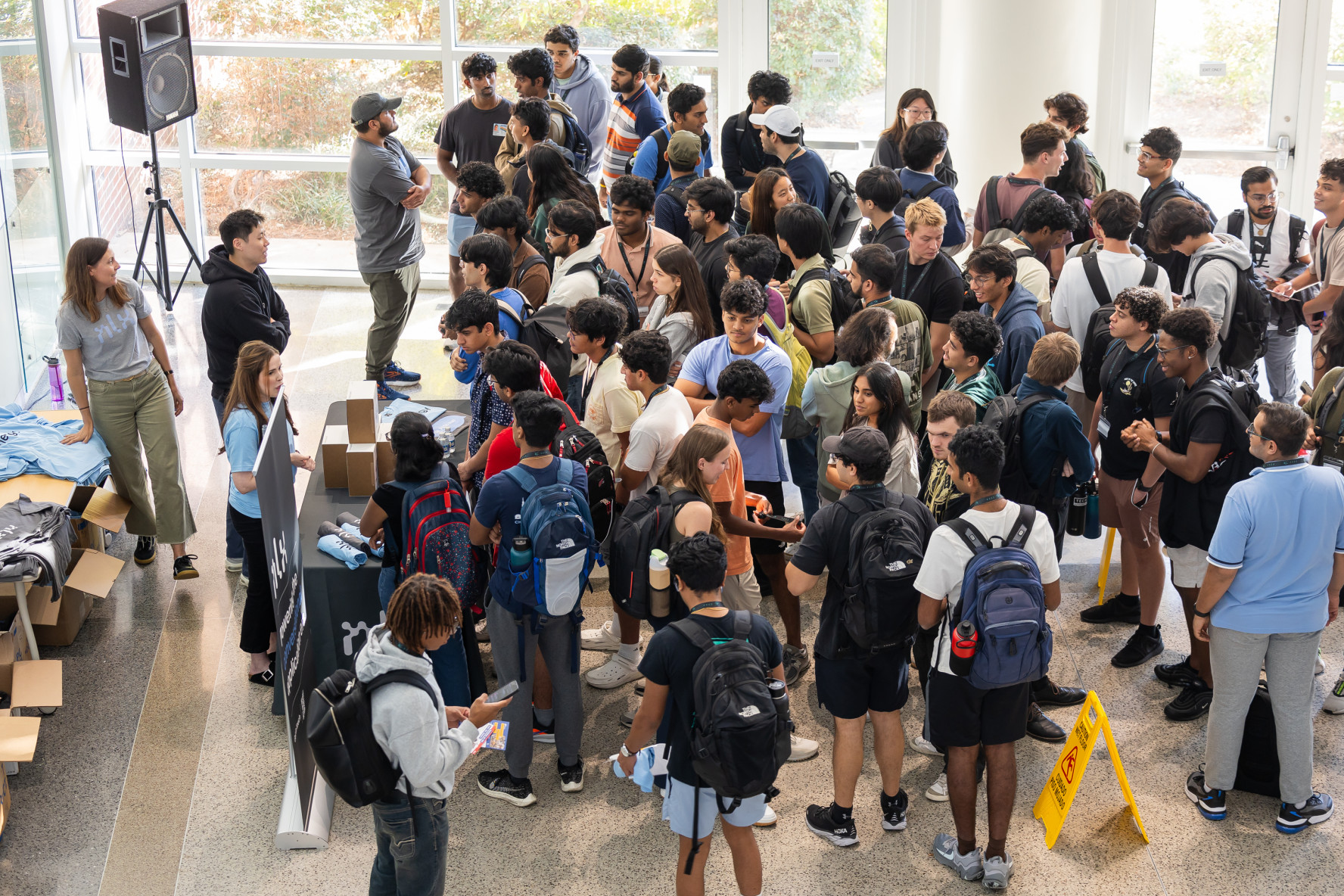 NLX team members greet dozens of excited students.